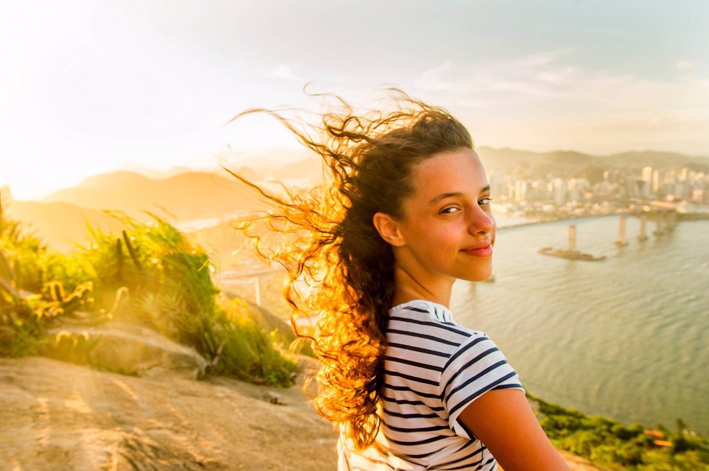 GIRL AT VIEW POINT DURING SUNSET, RIO DE JANEIRO, BRAZIL