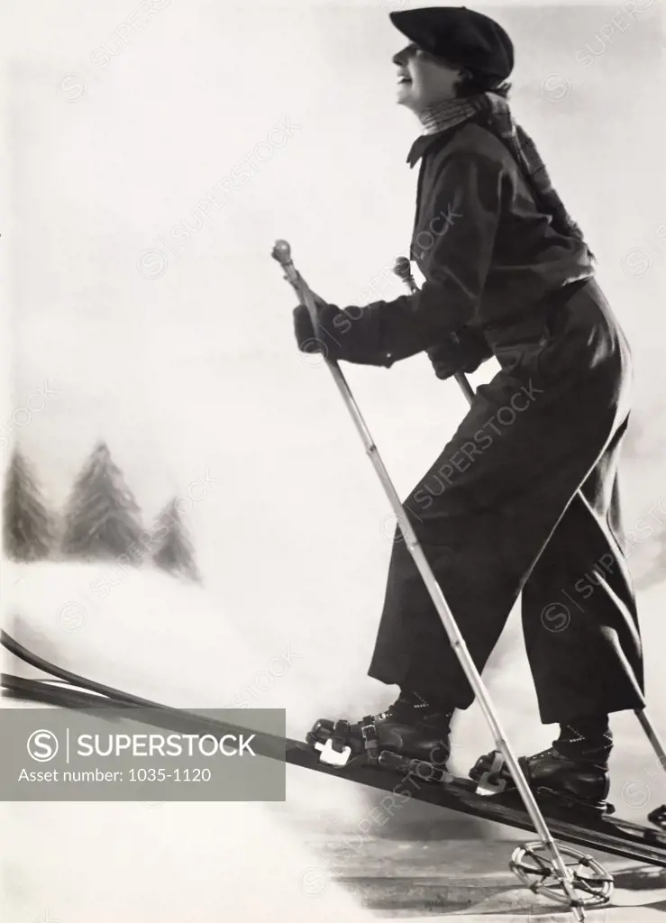 Side profile of a young woman skiing