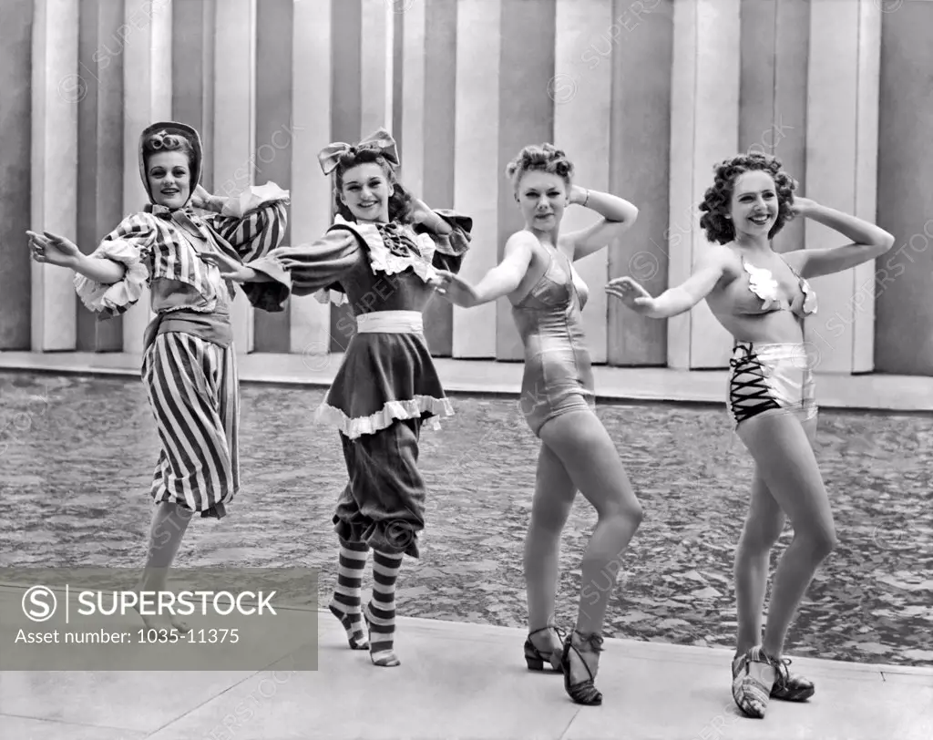 New York, New York:  July 4, 1939. Four of Billy Rose's 'Aquabelles' stage a fashion show of the past, present and future bathing suit styles at the New York World's Fair.©Underwood Archives