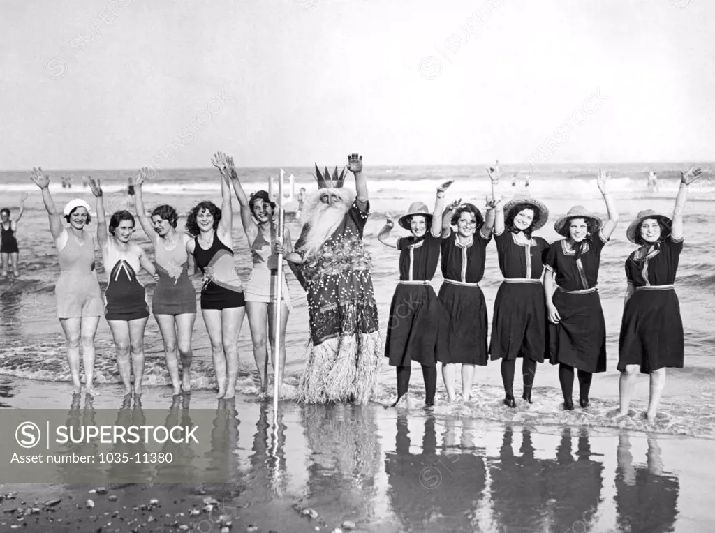 Wildwood, New Jersey:  c. 1930. King Neptune and his mermaids celebrate the first annual beach opening at Wildwood with water pageants and a bathing suit fashion show featuring the very old and newest styles.©Underwood Archives