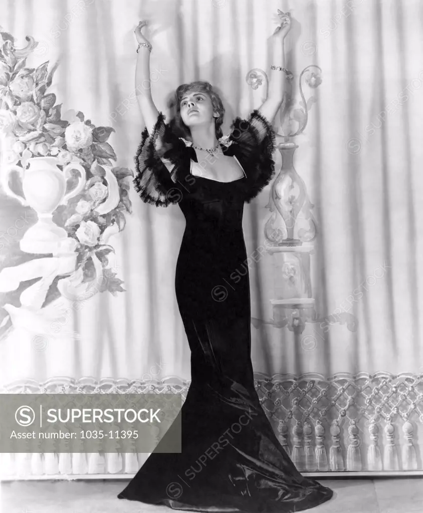 Hollywood, California:   c. 1938. Lillian Bond,  actress,(1908-1991) in an elegant black gown.©Underwood Archives