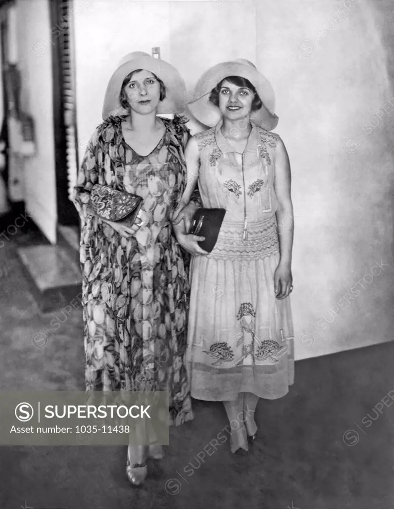 Manila, Phillipines:  March 23, 1931. Aimee Semple McPherson(L), and her daughtter, Roberta, as they stopped at the Manila Hotel en route to India. They were serenaded with 'Four Square Gospel' hymns in Tagalog by natives converted by one of her Filipino missionaries from Los Angeles.