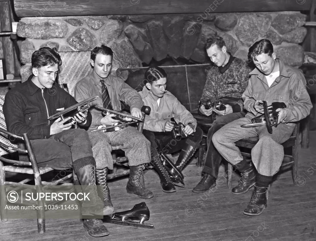 Bear Mountain, New York:  c. 1923. Speed skaters check their blades in preparation for the 1924 Winter Olympic tryouts to be held under the eye of Coach William Taylor at Brentmere Camp in New York state.©Underwood Archives