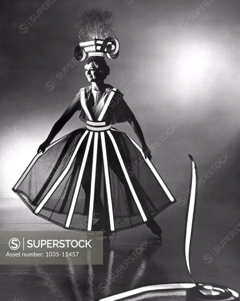 Los Angeles, California:  1966.   Ribbons of flexible Tape-Lite, a new Sylvania product, adorn the costume of Lee Carroll, the featured skater in the current Shipstads and Johnson Ice Follies.©Underwood Archives