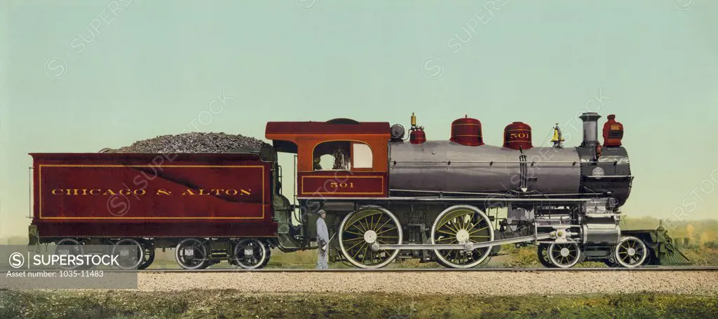 United States:  c. 1893. A photochrome of a Chicago & Alton Railroad locomotive with its coal tender car. This image was originally produced by the Detroit Publishing Company.