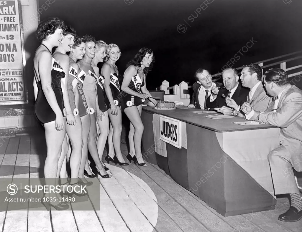 Palisades Park, New Jersey:  1953. Judges tasting the baking of the seven finalists in the Mrs. New Jersey contest. Judges are (L-R)Bobby Sherwood, band leader, Gal Drake, talk show host,  Frank Farrell, Stanley Willing.