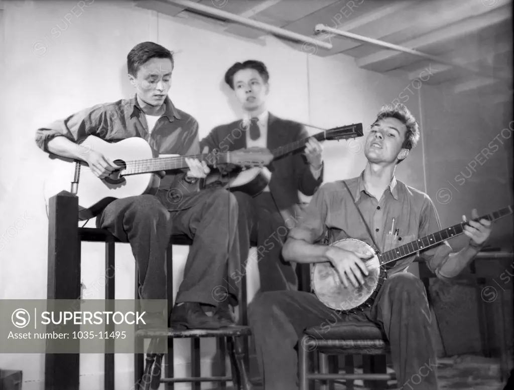New York, New York:  c.1940. L-R: Baldwin (Butch) Hawes, John (Peter) Hawes, Pete Seeger. Seeger was one of the founders of the Almanac Singers, and both Hawes brothers played with them at various times.