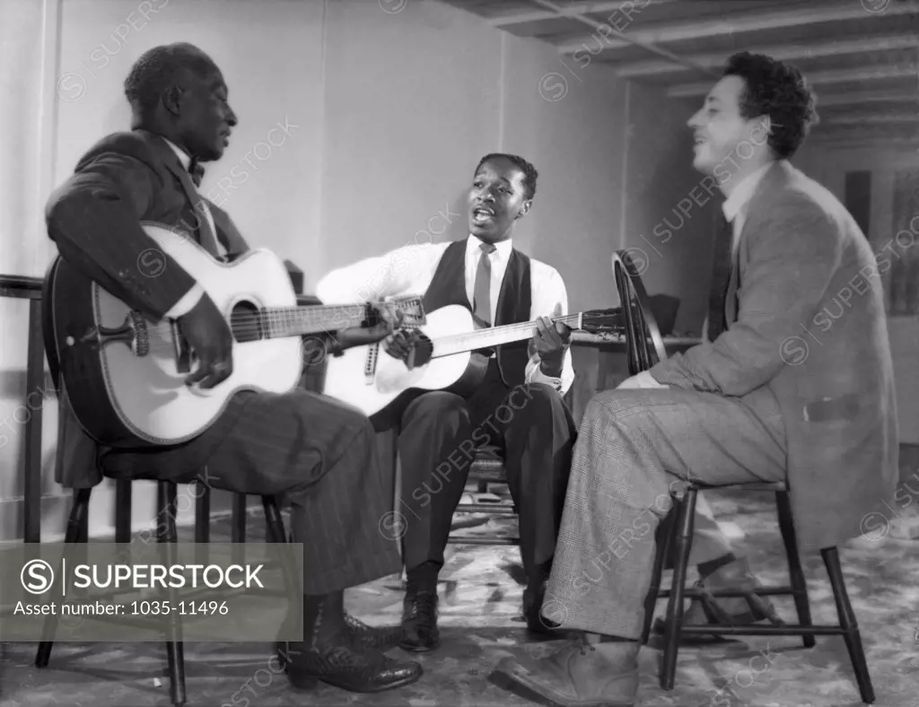 New York, New York:  c. 1940. L-R: Leadbelly, Josh White and Nicholas Ray. Ray became a film director; amongst his more notable films was 'Rebel Without A Cause', starring James Dean.
