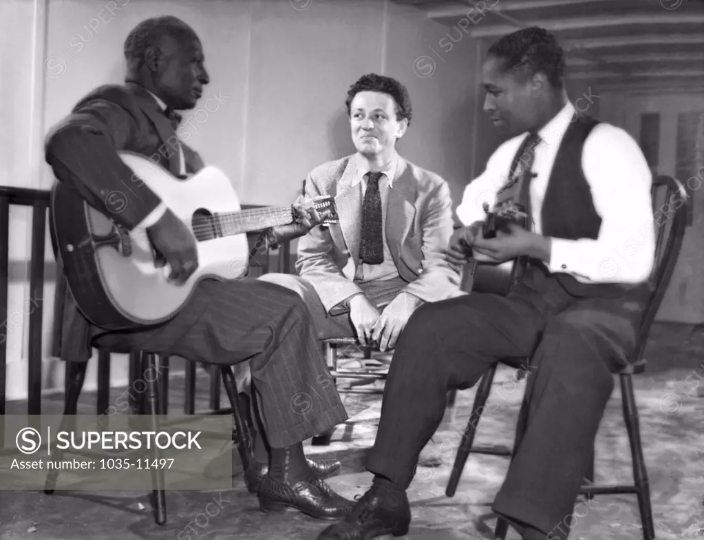 New York, New York:  c. 1940. L_R: Leadbelly, Nicholas Ray, Josh White.  Ray became a film director; amongst his more notable films was 'Rebel Without A Cause', starring James Dean.