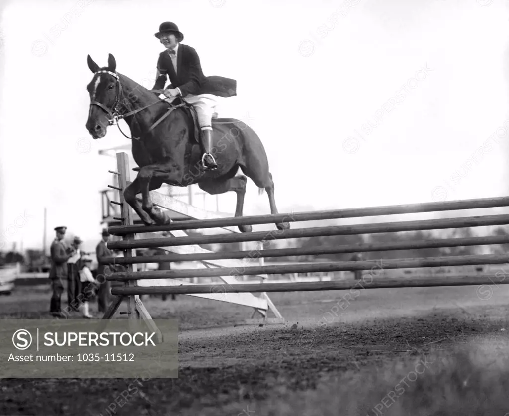 Washington, D.C.:  October 15, 1925. Pat Murphy of the Rock Creek Hunt Club taking the jumps on the first annual field day of the season.