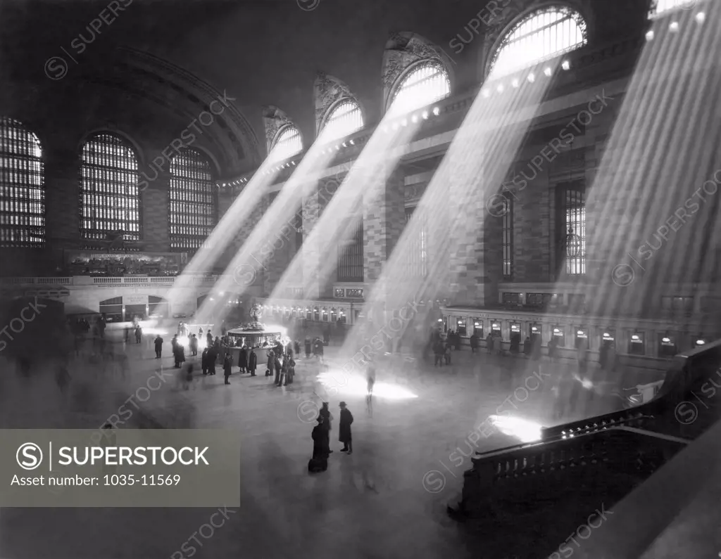 New York, New York:  c. 1940's. An interior shot of the Grand Central Railroad Station, with sunlight streaming in through the clerestory windows above.