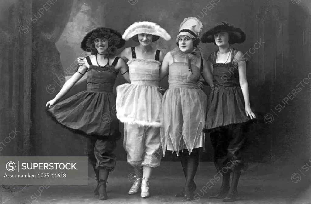 San Francisco, California:  c. 1890. Four young women on the vaudeville stage in fancy costumes and hats.