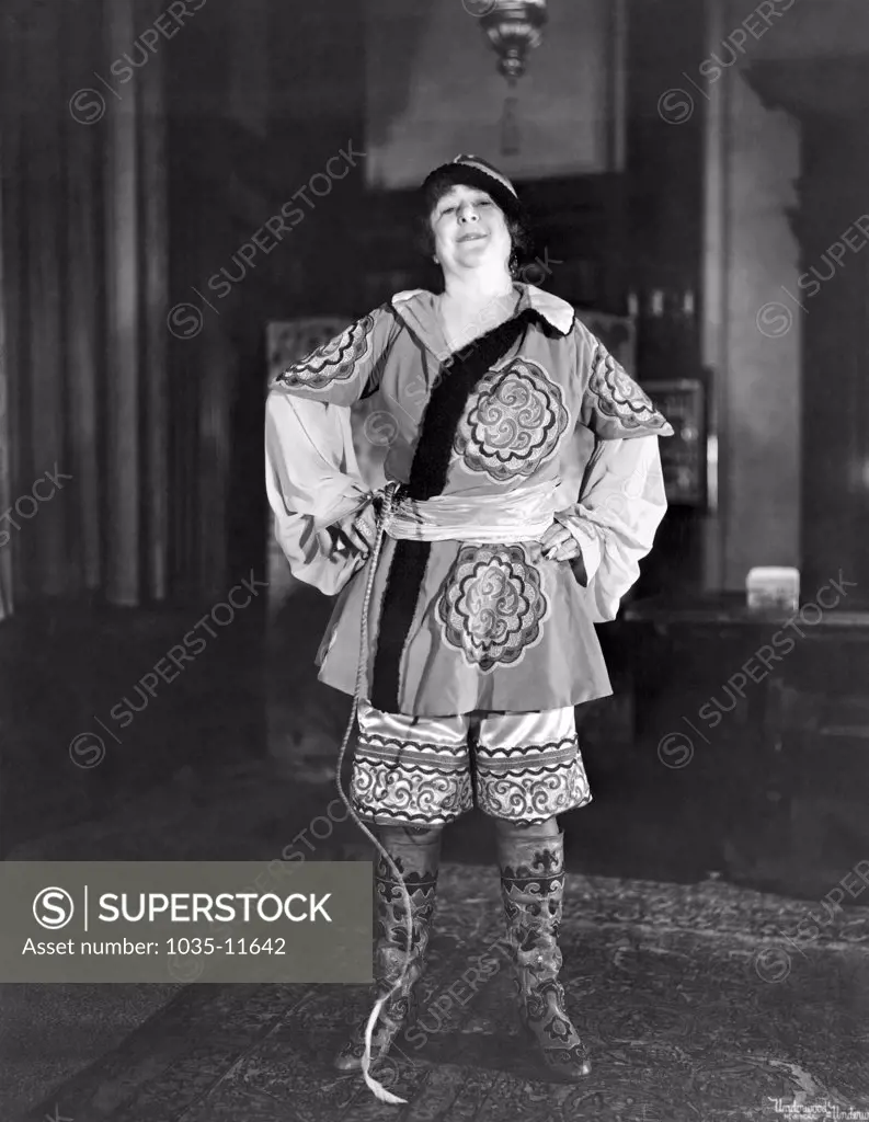 Ossining, New York:  c. 1928. A New York society matron in her Russian Cossack oufit that she will wear to the Thanksgiving party at the MacDowell Club.