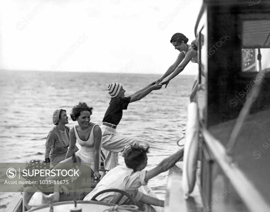 Miami, Florida:  c. 1924. Society women board a fishing cruiser at the Key Largo Anglers Club