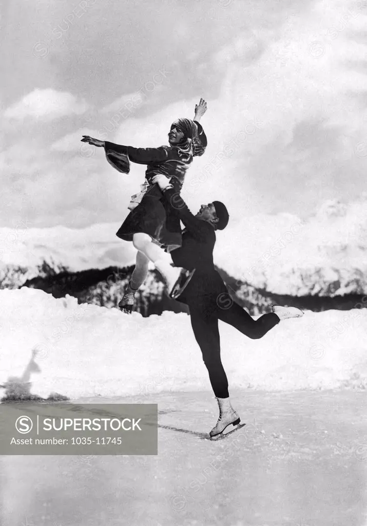 St. Moritz, Switzerland:  c. 1925. Hilde Ruckert and Howard Nicholson show a perfect pairs' lift at this popular Swiss resort.