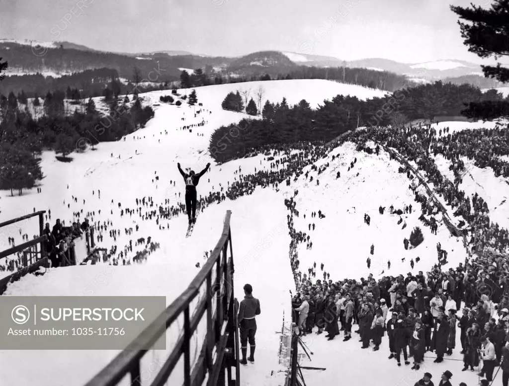 Hanover, New Hampshire:  February 6, 1937.  A view of the ski jump at the annual Winter Carnival of the Dartmouth Outing Club.  Shown here is Jarvis Schauffler of the Amherst Outing Club who was on the US Downhill Ski Team in the 1936 Olympics.
