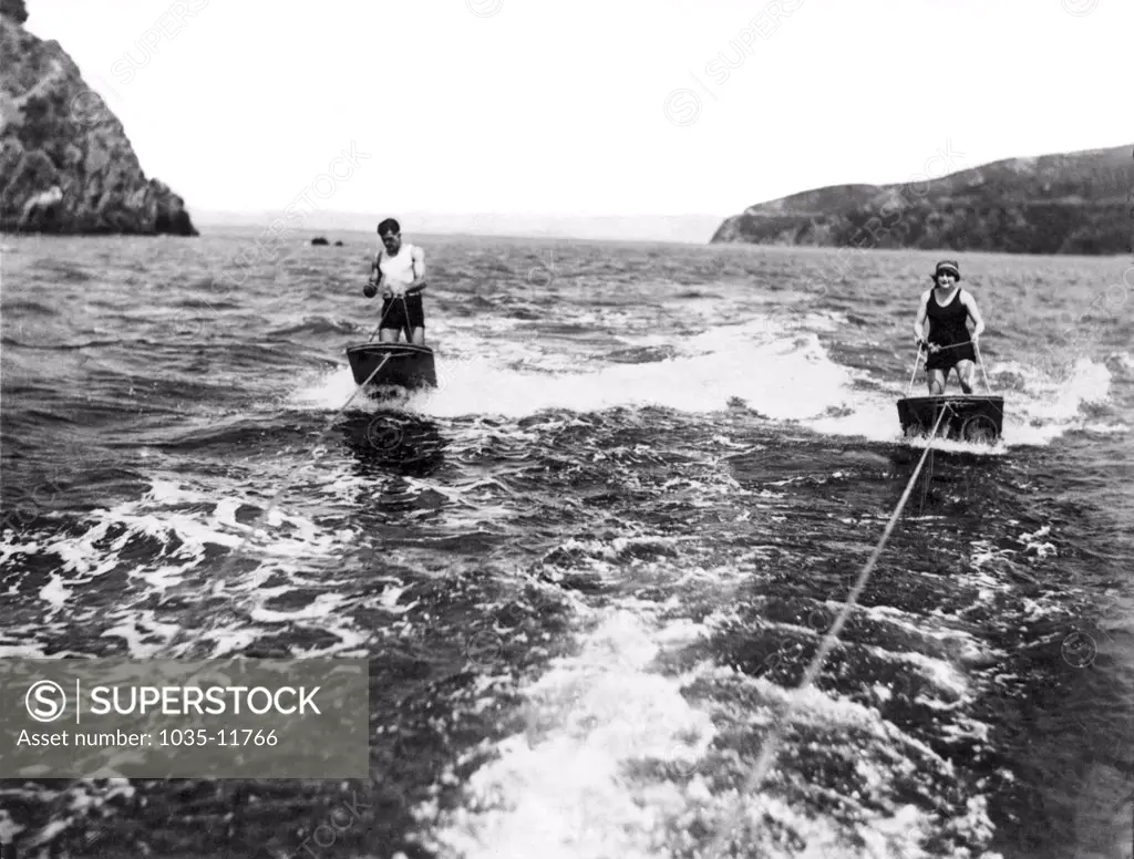 San Francisco, California:  August 24, 1923. A couple brave the chilly waters of San Francisco Bay for a high speed dual aquaplane ride.
