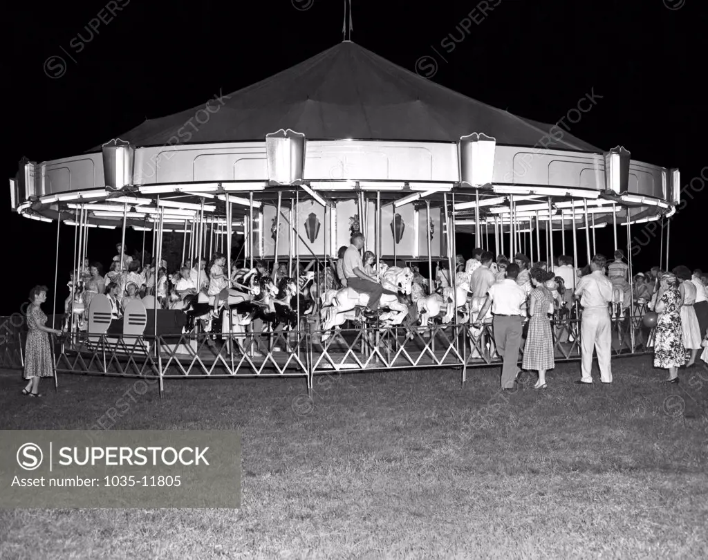 Springfield, Ohio:  c. 1960. A Gooding Amusement carousel at a carnival in Ohio.