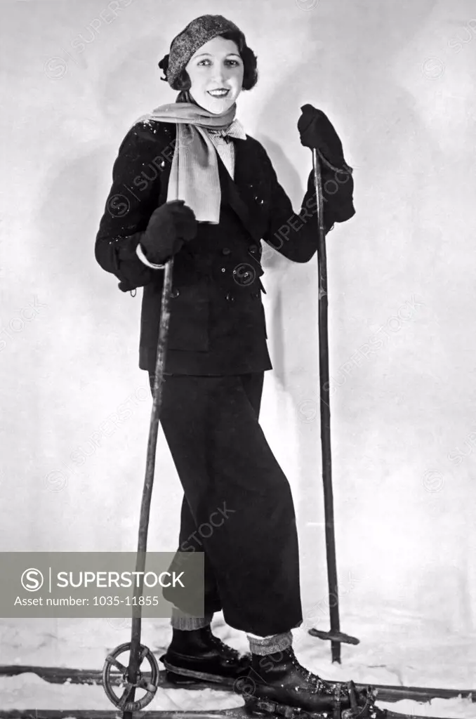 Paris, France:  c. 1930. The latest ski ensemble from Paris in a maroon flannel. The bonnet is in maroon and red.