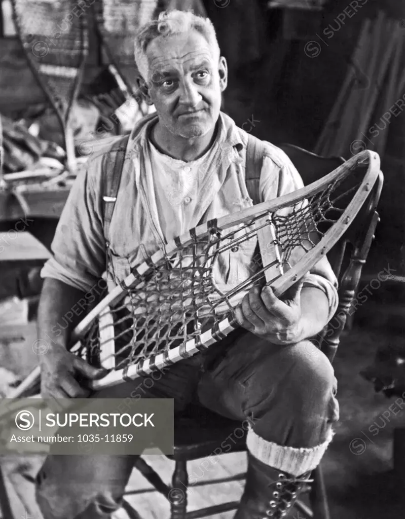Norway, Maine:  January 18, 1926. Nathan Noble, son-in-law of Maine fiddling champion Mellie Dunham, will soon be part  of her act in a New York theater. Noble has been making snowshoes for the past 25 years.