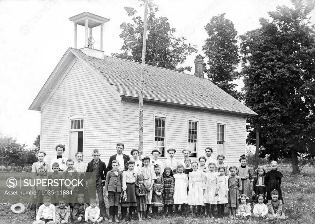 Grand Junction, Michigan:   c. 1890. A one room school house with the children of all ages.