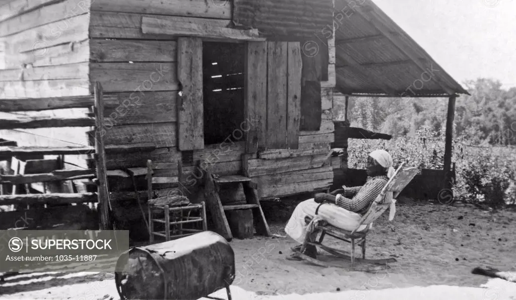 American South:  c. 1938. Julia Ann Jackson, age 102, and the corn crib where she lives. She uses the large battered tin can for a stove and does her cooking on it. Julia Ann is an ex-slave and was a grown woman when the Civil War broke out.