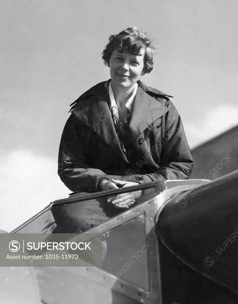 United States:  c. 1936. Amelia Earhart in the cockpit of her Lockheed Electra airplane.