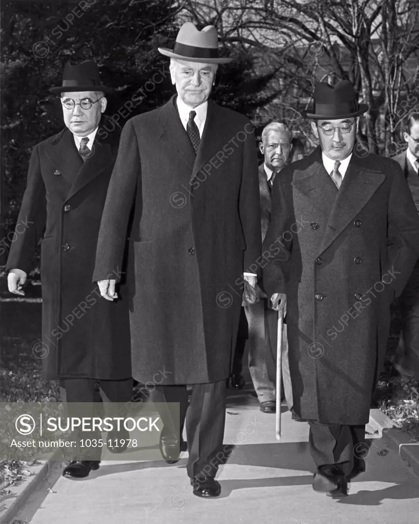 Washington D.C.:  November 17, 1941. Saburo Kurusu, (right) Japan's special envoy for a 'final attempt at peace', Secretary of State Cordell Hull, and Kichisaburo Nomura, (left) Japanese Ambassador to the United States, arrive at the White House for a 70 minute conference with President Roosevelt. The President told them that he hoped a major conflict in the Pacific could be avoided.