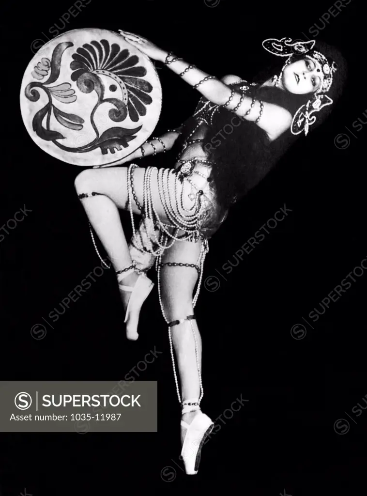 Italy:  December 3, 1927. Beautiful Russian dancer Eugenie Nikitine dancing one of her own creations and she is scoring a tremendous hit in Italy