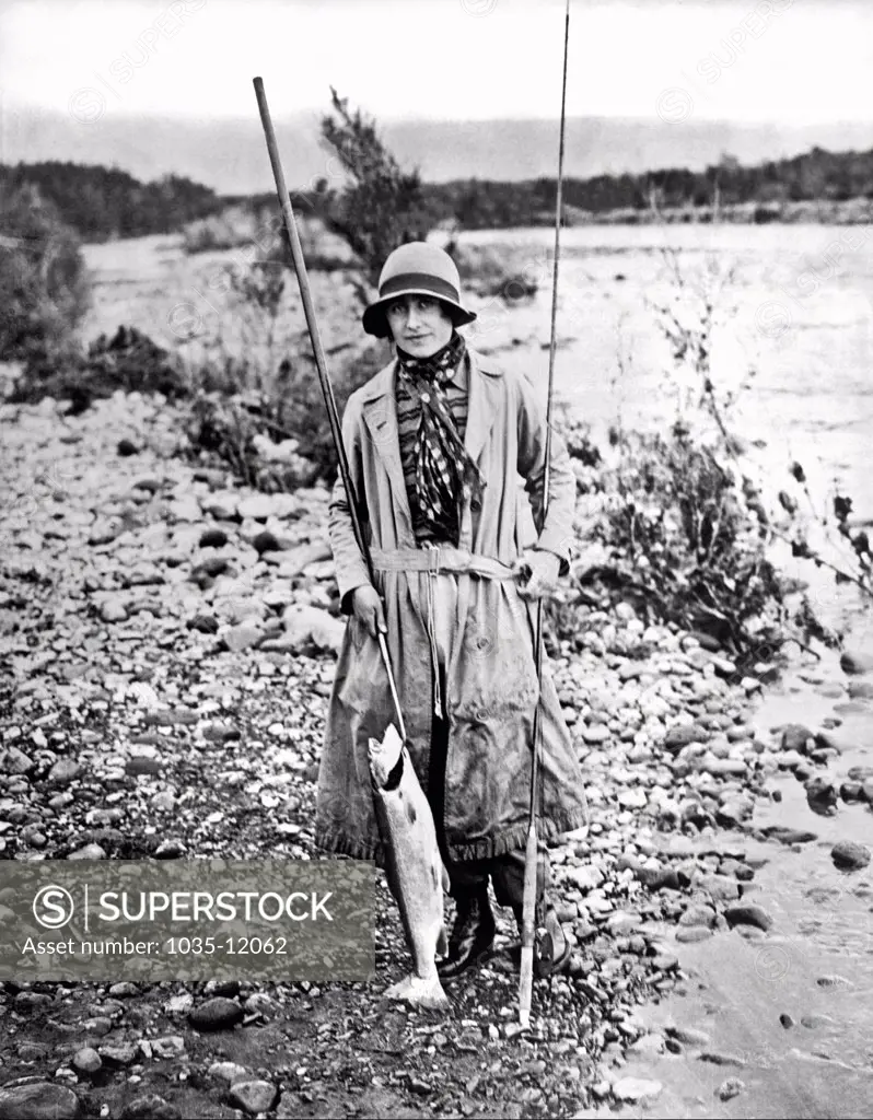Tokaanu, New Zealand:  April, 1927. The Duchess of York who is making a tour of British Possessions, with a 7 pound trout she caught. She later became Queen Elizabeth, consort to King George VI.