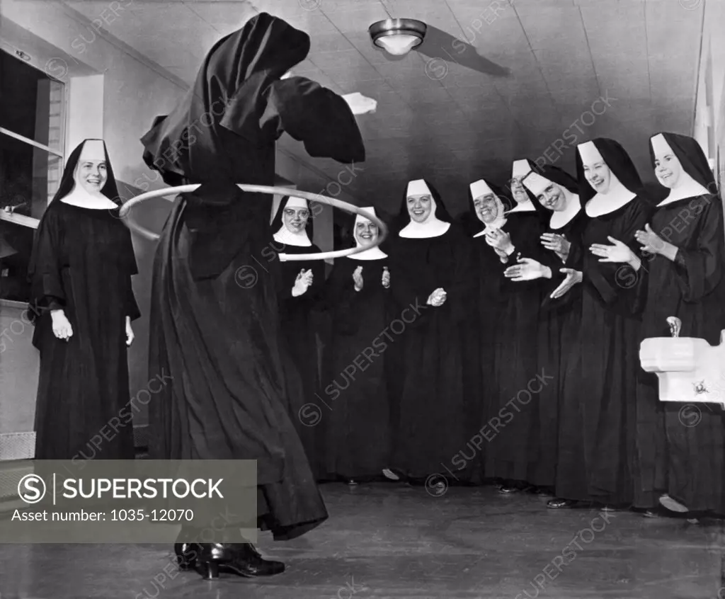 Oklahoma City, Oklahoma:  October 18, 1958. Benedictine Sisters at the Christ King Convent in Oklahoma City try their hand at the hula hoop craze that is sweeping the country.