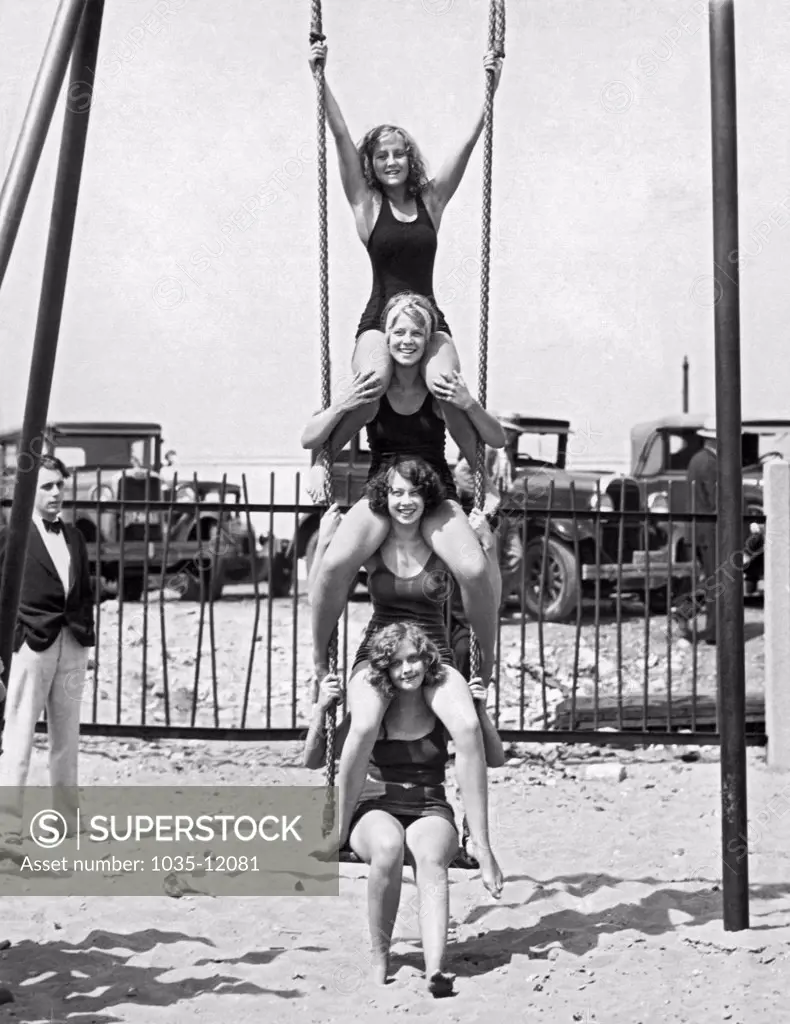 Chicago, Illinois:  August, 1930. An apparent swing shortage has these northside girls piled four deep along the beach.