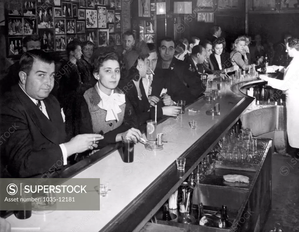 New York, New York:  c. 1945. A crowded and smokey bar scene in the WWII era.