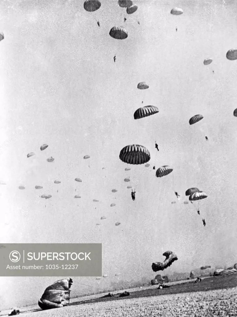 Germany:  March 31, 1945. Members of the First Allied Airborne Army drop behind German positions on the far side of the Rhine. Some have already landed and are set for their first objective, a German farmhouse filled with Nazi troops and civilians.