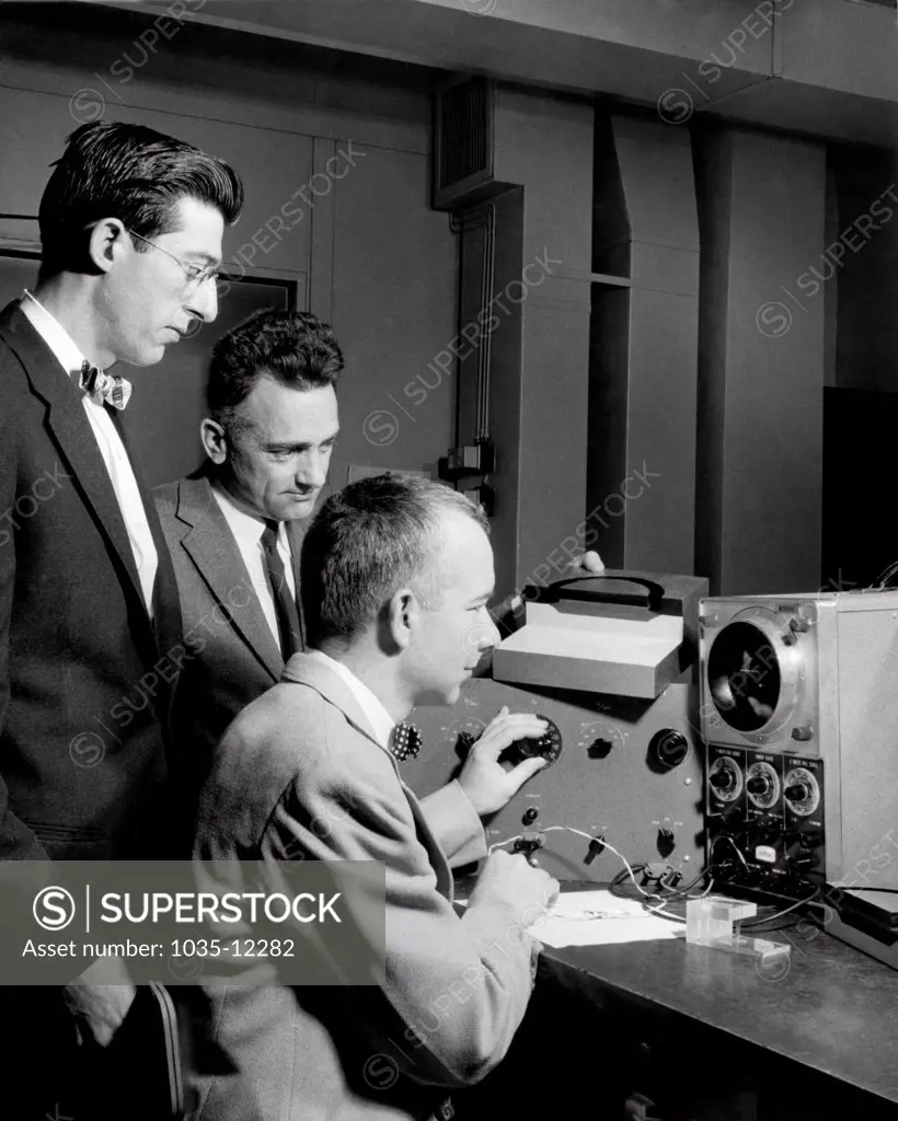 United States:  December, 1957. E.I. Doucette, H.A. Stone, and R.M. Warner, Jr. testing their new field-effect varistor that they invented at Bell Telephone Laboratories.