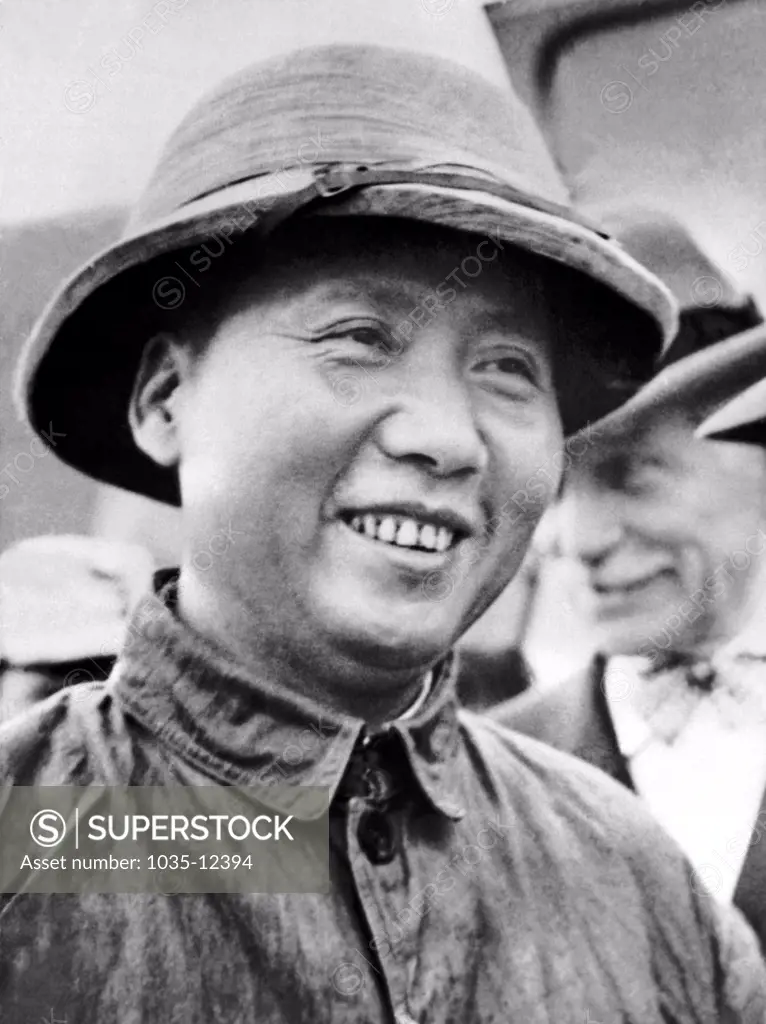Chungking, China:   September 14, 1945 Communist faction leader Mao Tse-Tung arrived with U.S. Ambassador Maj. Gen. Patrick Hurley to meet with Chiang Kai-Shek. General Hurley went to Yenan to fetch Mao and guarantee his safety.