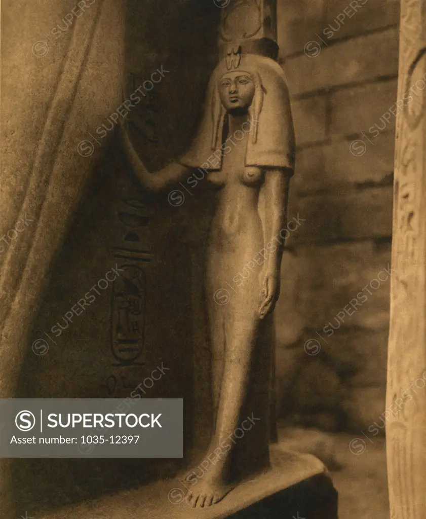 Luxor, Egypt:  c. 1880. A statue of one of Ramses II wives in the Temple Of Luxor.