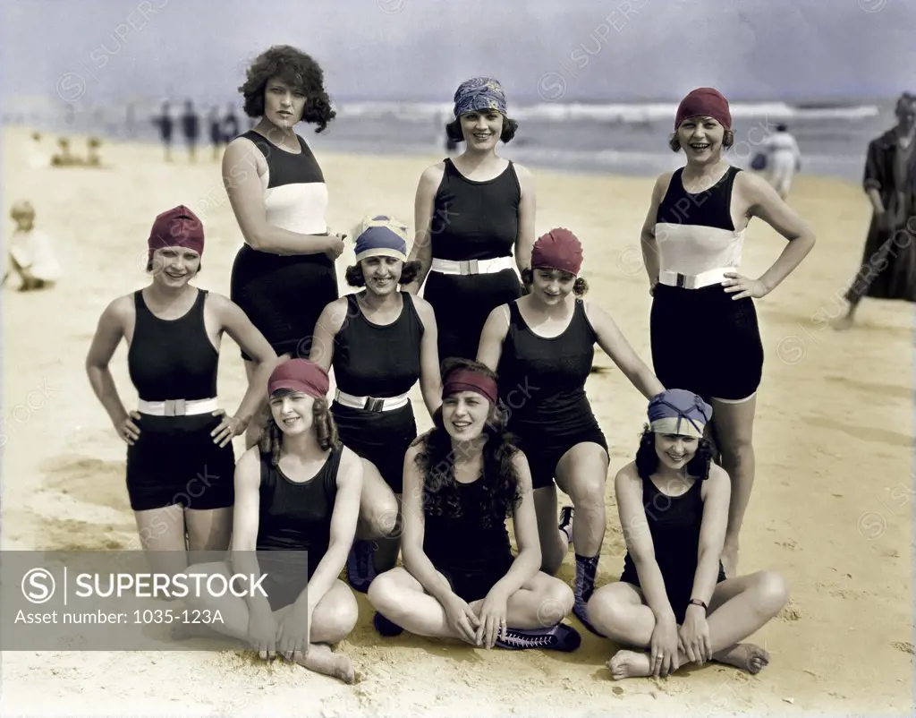 Portrait of a group of young women and teenage girls posing on the beach