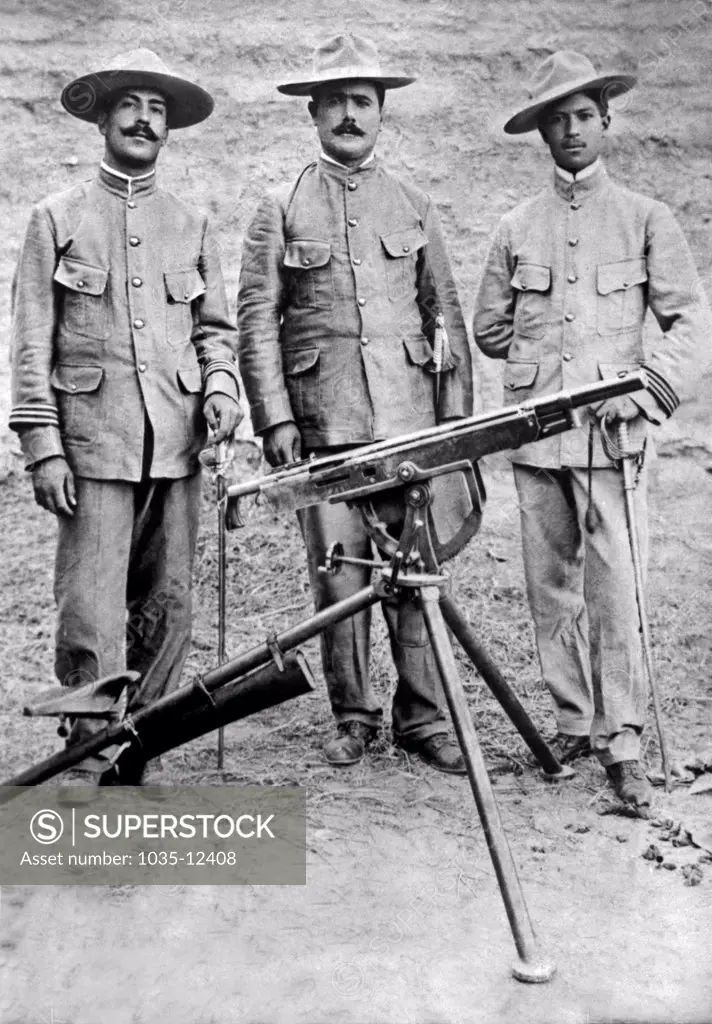 Mexico:  November 20, 1913. The commanders of the highly regarded Mexican rebel machine-gun regiment. Left-Right: Captain Antonio Guirrero, Colonel Alvaro Obregon, Captain Jose Rocha.
