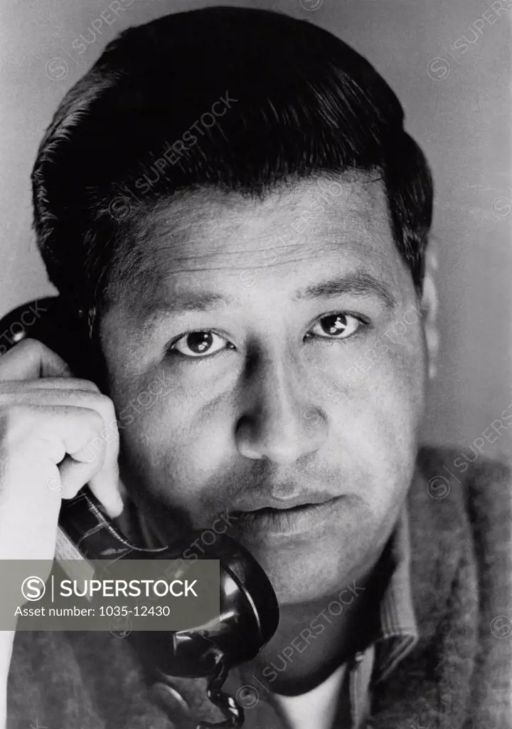 California:  June 10, 1967. Portrait of Cesar Chavez talking on the phone.