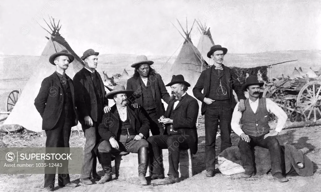 Wyoming:  c. 1875. Frontier men at an Indian camp in Wyoming.