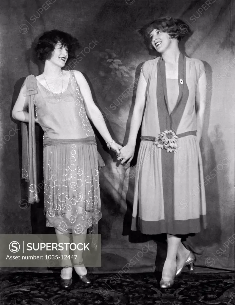 New York, New York:  1925. Stage and silent film actresses at the Hotel Astor. Francine Larrimore and Sigruid Holmquist holding hands at the famous annual Equity Ball held in New York city.