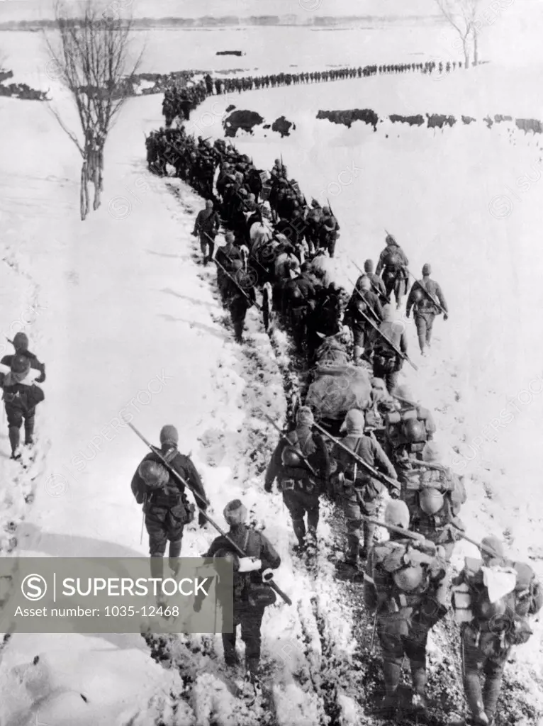 Chaoyang, Manchuria:  March, 1933. Troops of the Japanese 6th Division infantry trudge through a foot of snow in zero degeree weather on their way to Chaoyang and then on to Chifeng in Inner Mongolia.