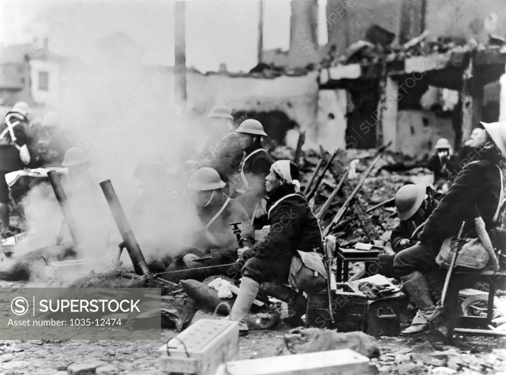 Shanghai, China:  1937. Japanese troops use trench mortars in the streets of Shanghai during their invasion of China.