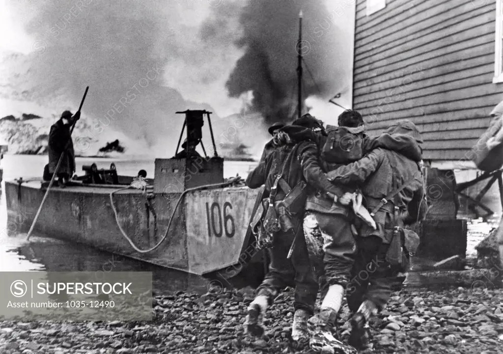 Vaagso, Norway:  December 27, 1941. A wounded British Commando is being evacuated after a raid on German suppy depots in Norway.