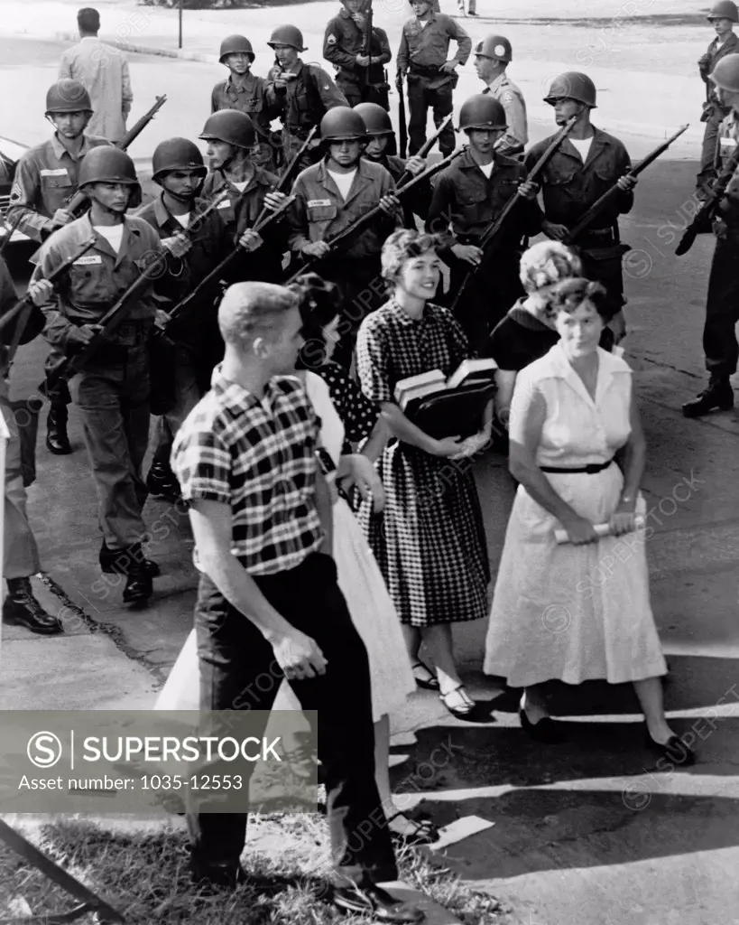 Little Rock, Arkansas: 1957 Armed National Guardsmen disperse a group of white students as they staged a walkout of the Central High School campus in Little Rock, Arkansas in opposition to integration