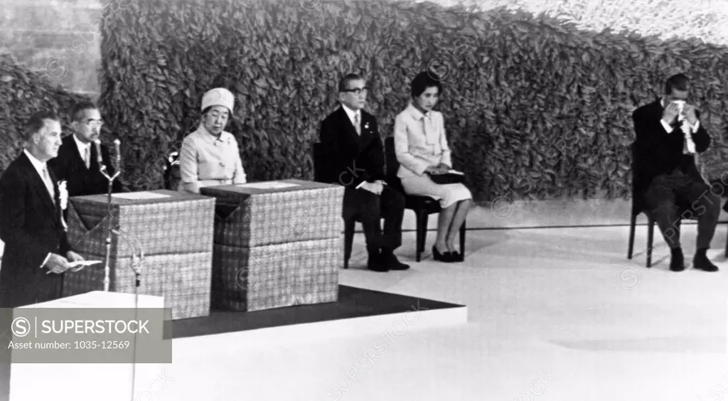 Tokyo, Japan:  May 15, 1972 Prime Minister Eisaku Sato, far right,  wipes his eyes as Vice-President Spiro Agnew reads the Presidential proclamation reverting Okinawa back to Japan. Emperor Hirohito and Empress Nagako are seated to Agnew's left.
