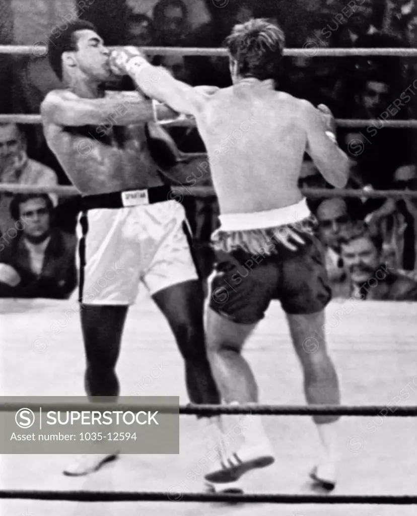 Atlanta, Georgia:  October 26, 1970 Jerry Quarry slams a left into Muhammad Ali's mouth in the second round of their fight. The fight was stopped after the third round because of Quarry's badly battered eye.