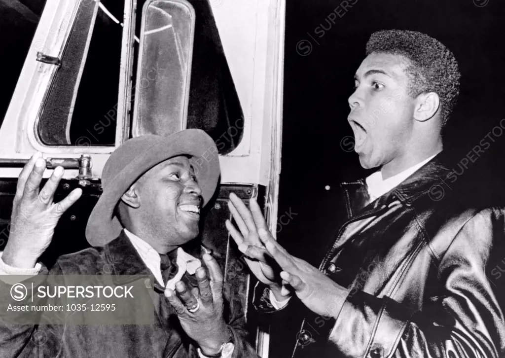 Denver, Colorado:   November 4, 1963 Accompanied by comedian Clay Tyson, Cassius Clay predicts the fight with Heavyweight Champion Sonny Liston will end in the 8th round.