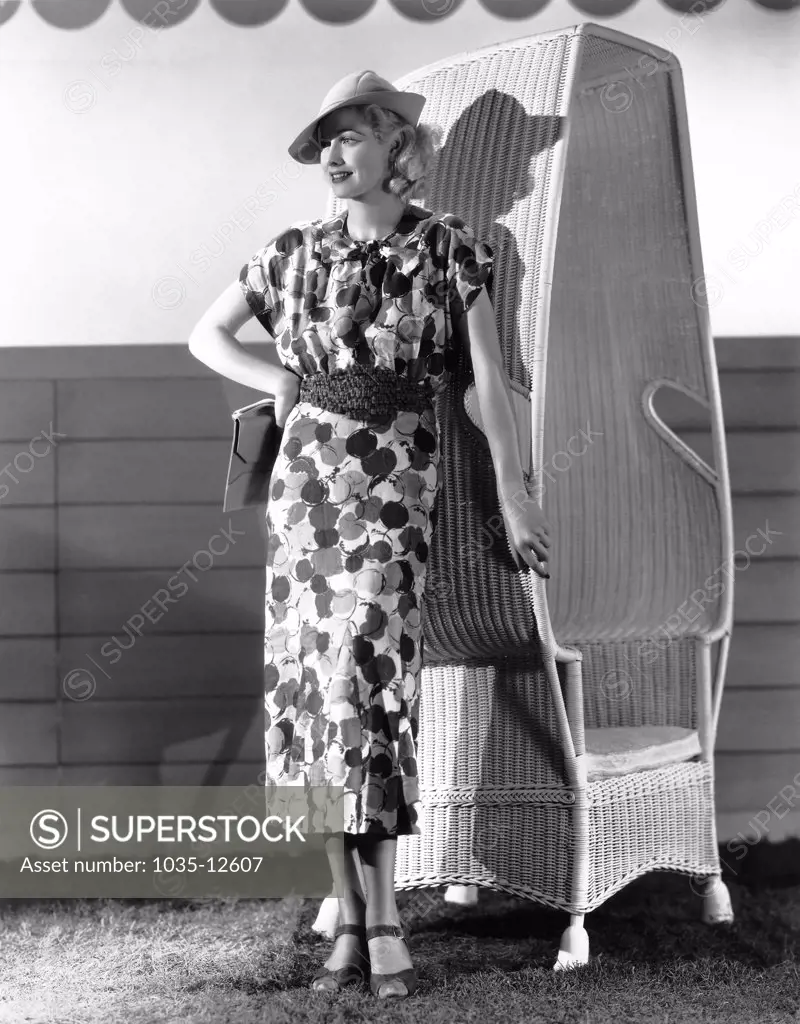 Hollywood, California:  1936 Actress Lucille Ball, popular RKO Radio Pictures player, models the latest in printed linen for spring fashions.